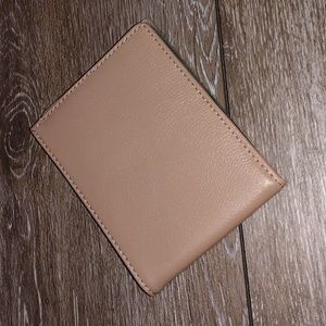 Taupe colored leather wallet. NWOT